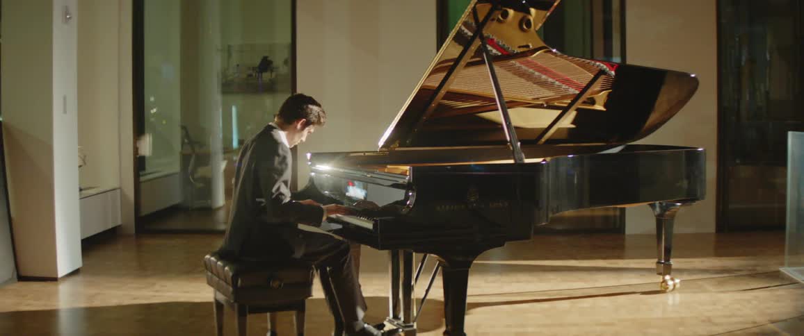 A person is playing piano indoors