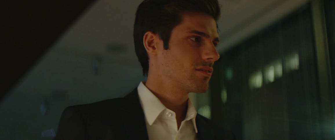 A man wearing a suit walking