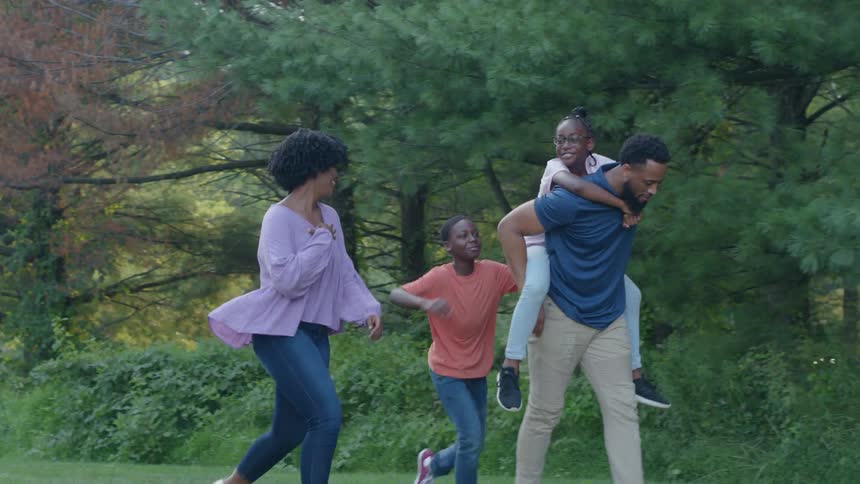 A family is walking outdoors together
