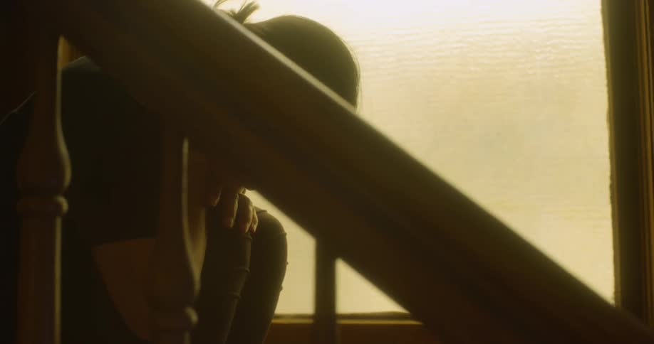 A person is sitting on stairs