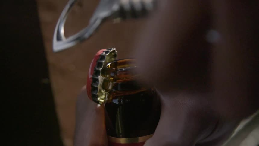 A bottle is opened