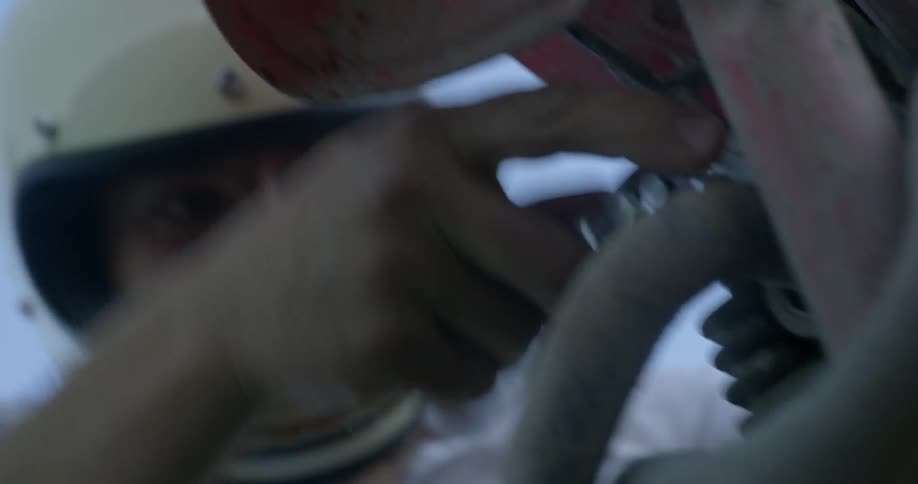 A person is fixing a bike outdoors