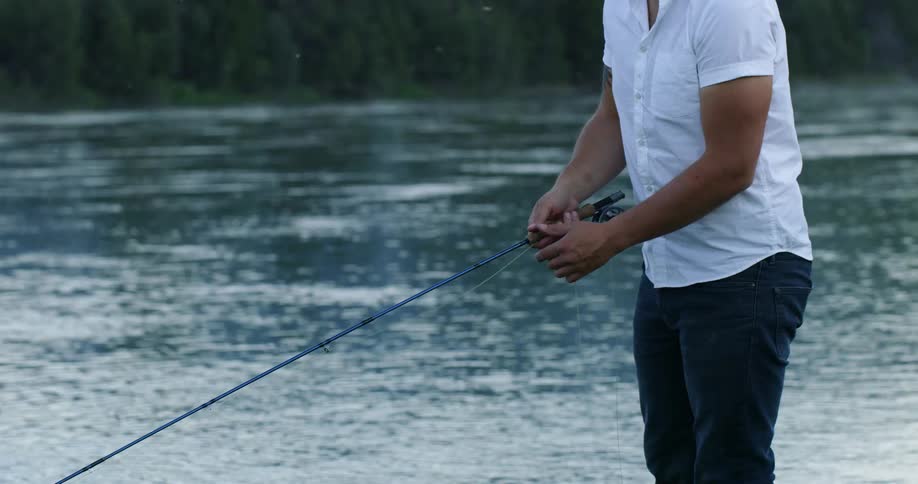 Man reels in his fishing line