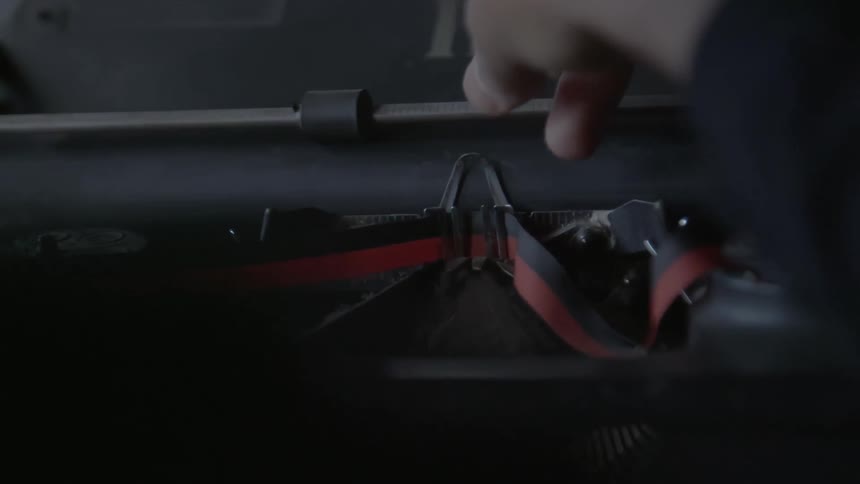 A person is repairing a machine