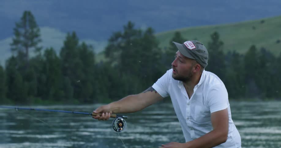 A man is fly fishing in the river