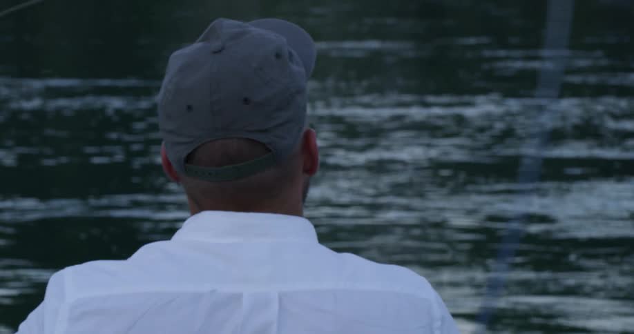 A man fishes in the lake