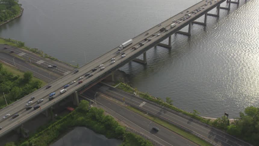 Cars driving on the road and a bridge
