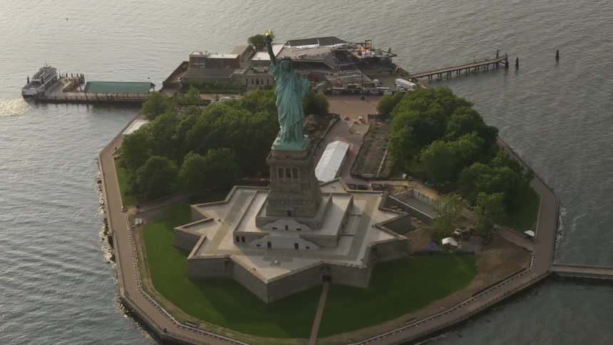 The statue of liberty can be seen far below