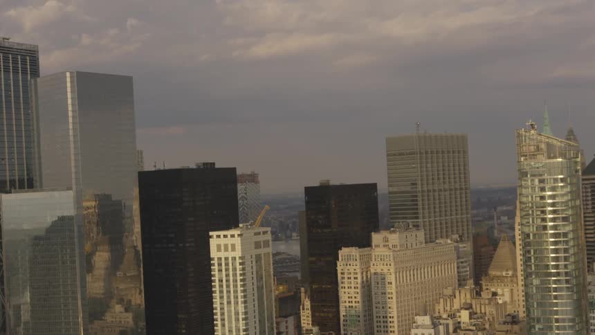 A city skyline adorned with reflective buildings and cranes