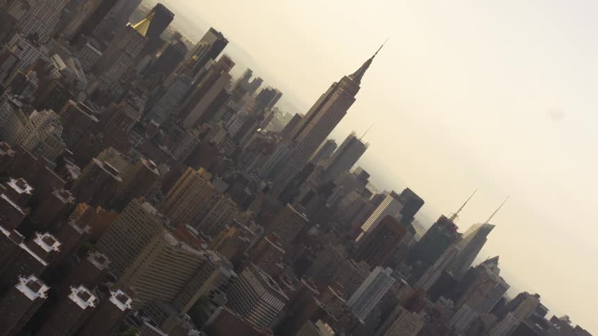 Buildings and skyscrapers in new york city at sunset