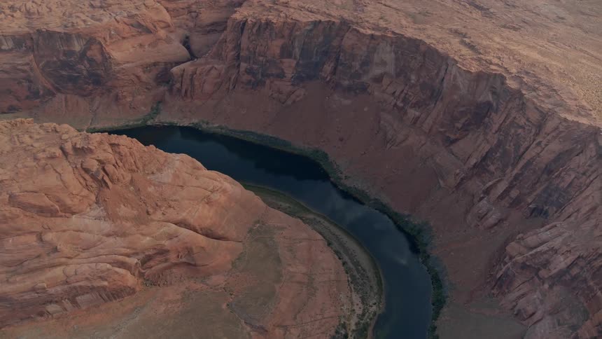 The river runs through the large canyon
