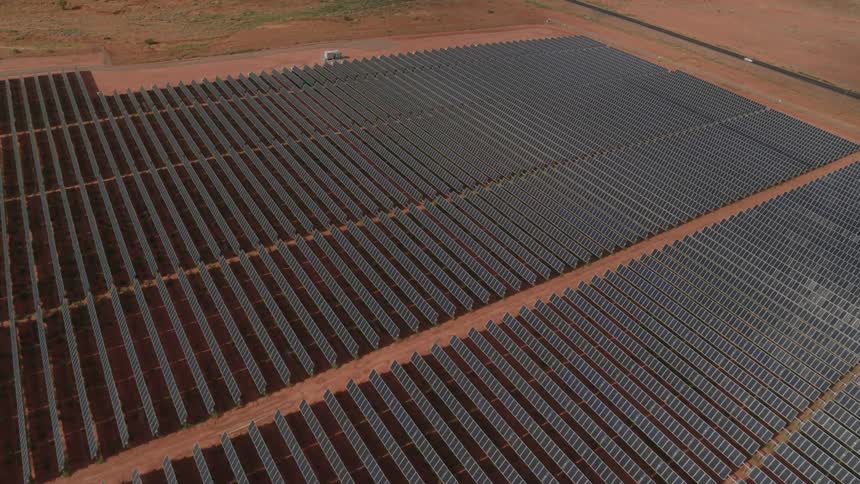 The solar panels of a solar farm in a desert
