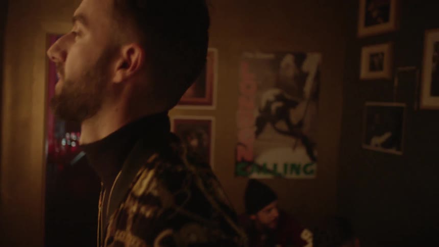 A man walks through the club with a friend