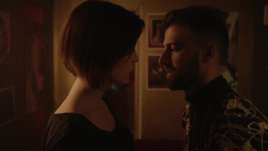 A man goes to kiss a woman