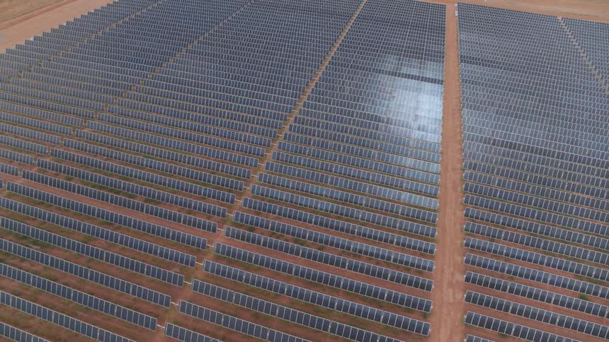 Large array of solar panels in a desert