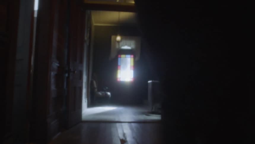 A panicked man trying desperately to get out of a house