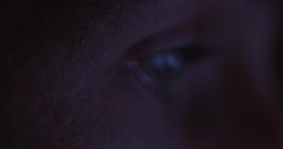 A person is looking at something in the dark