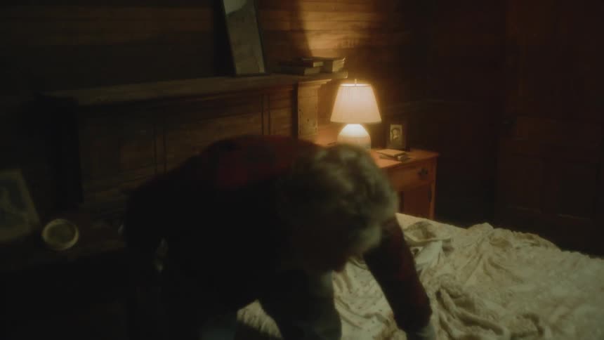 An elderly man getting out of bed because of flashing lights