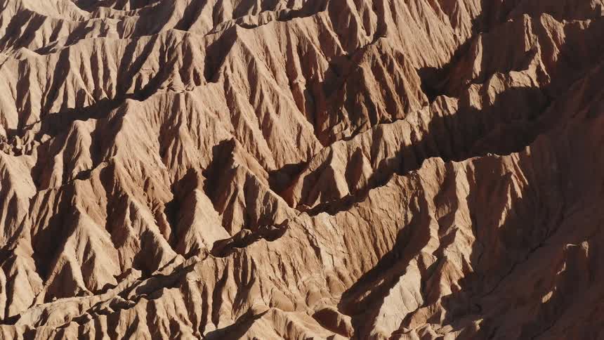 The canyons below are rigid and vast