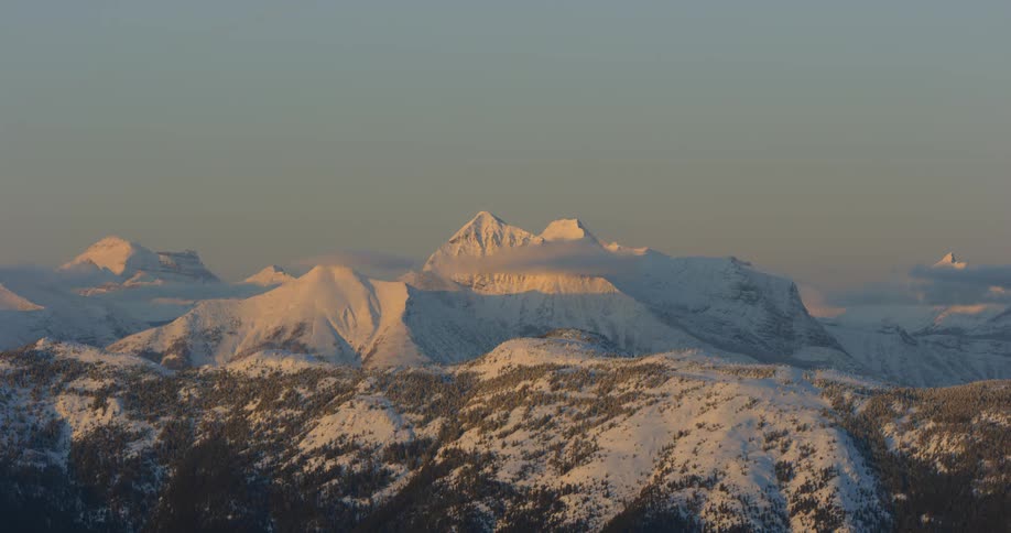 The mountain range ahead is covered with snow
