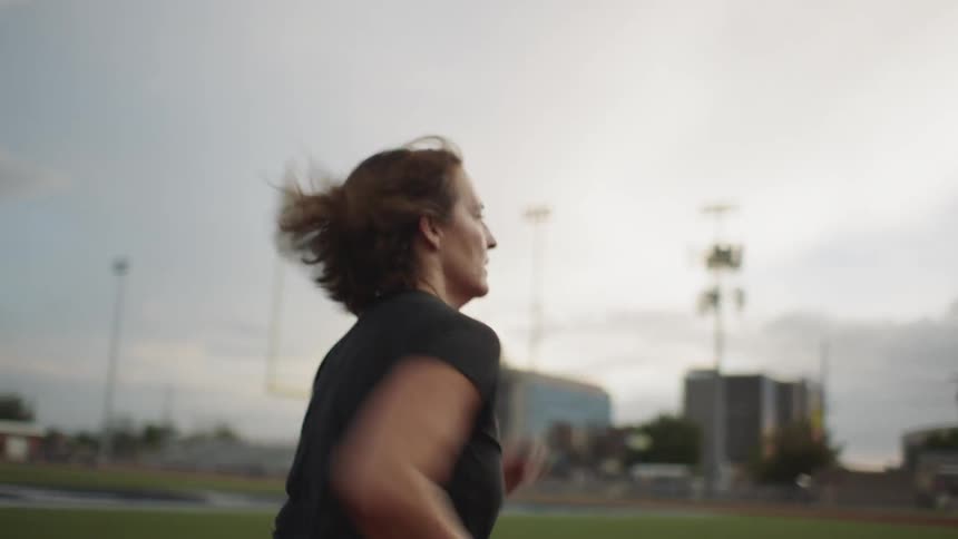 A woman running on a track
