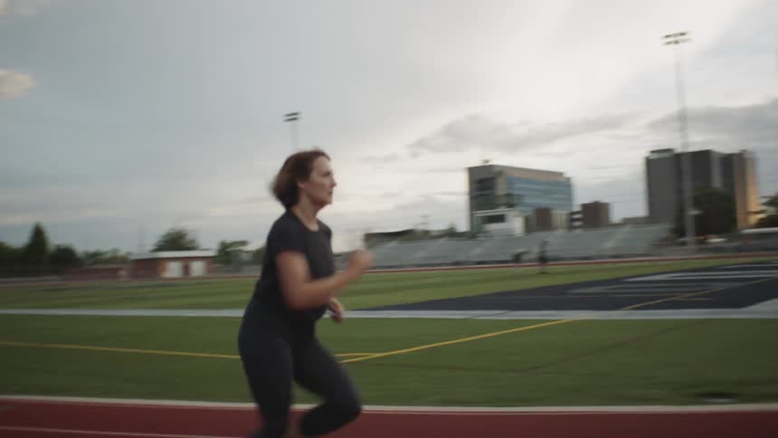A woman running on a track