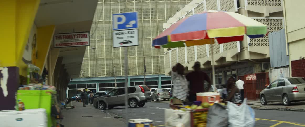 People walking, shopping and sitting at street cafes on a city street