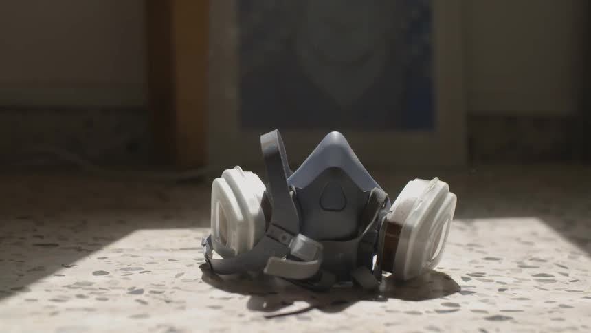 A mask falls onto the floor