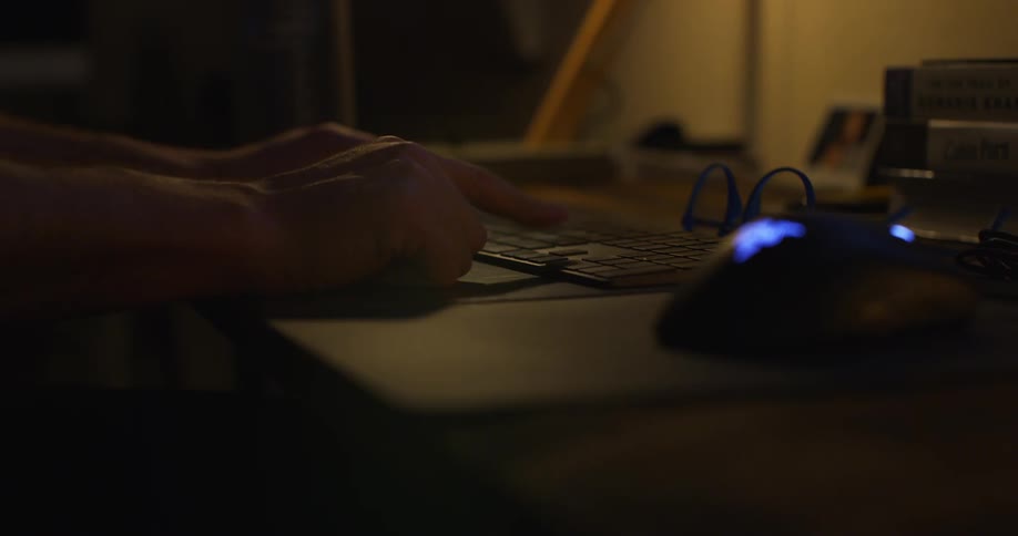 Person taps keys on keyboard with index finger