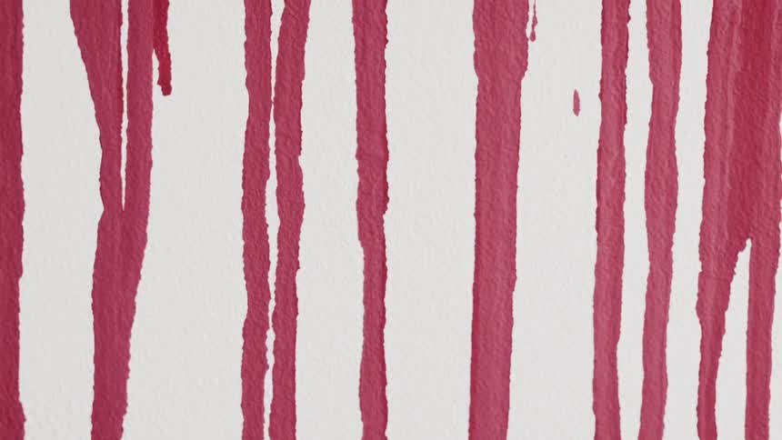 A set of red lines bleed into one another on a white canvas