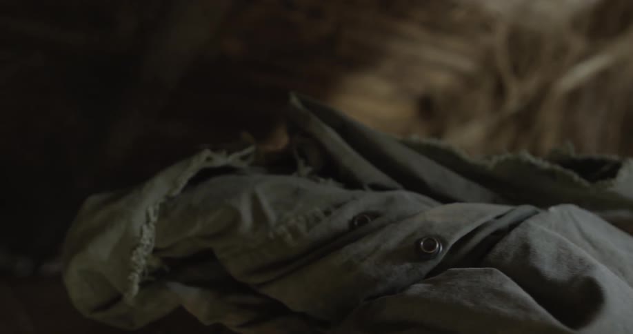 A boy taking things off of a chest