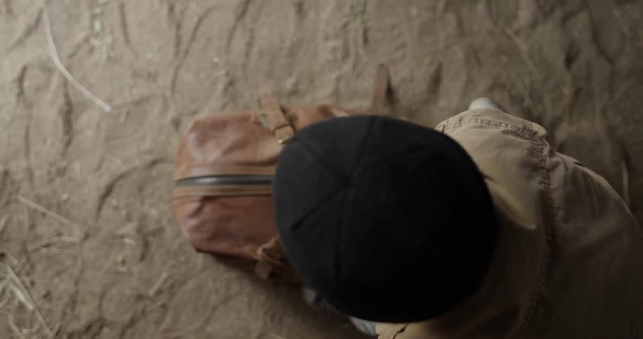 A person collecting a bag