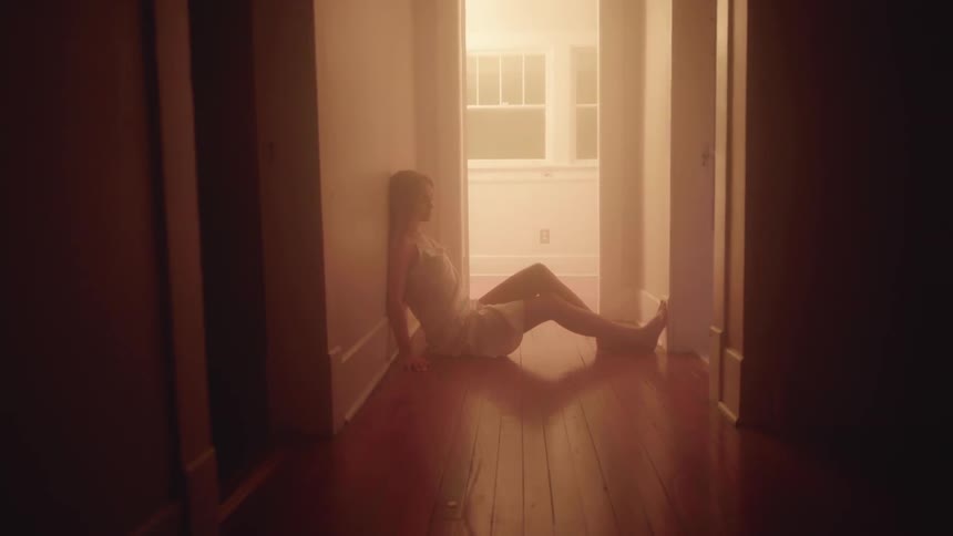 Girl Lays in Hallway