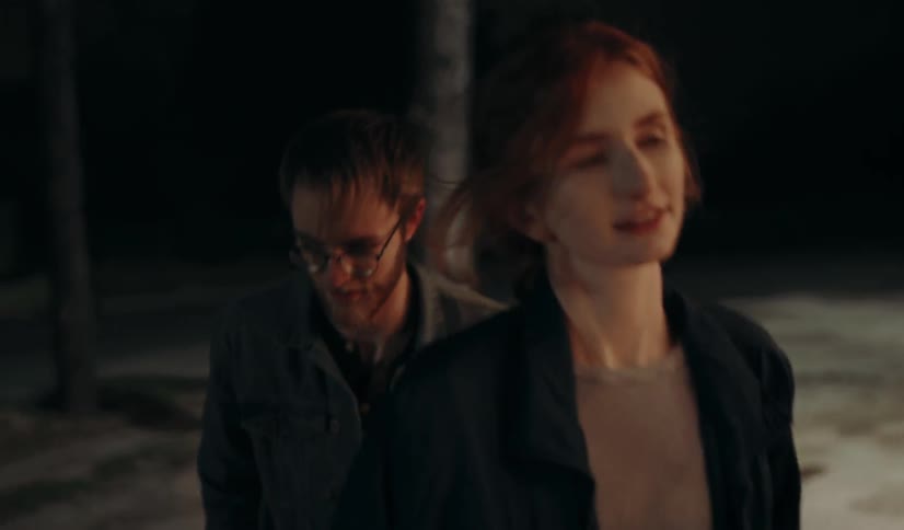 Man and woman walking together at night