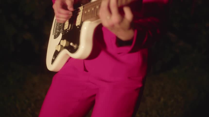 A woman is playing guitar