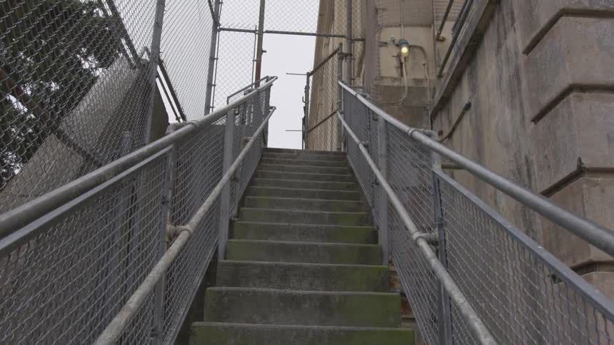 Railings line the concrete stairs