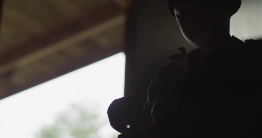 Person standing in the dark on a cloudy day