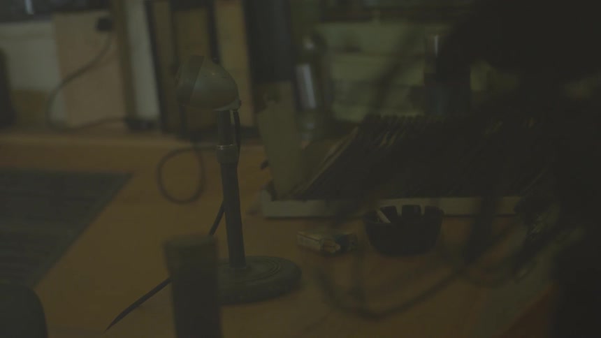 A room is dark and has objects