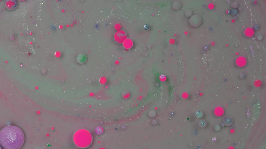 Colorful oils turning around in a liquid