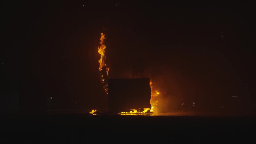Abstract People Burning Various Objects In Warehouse
