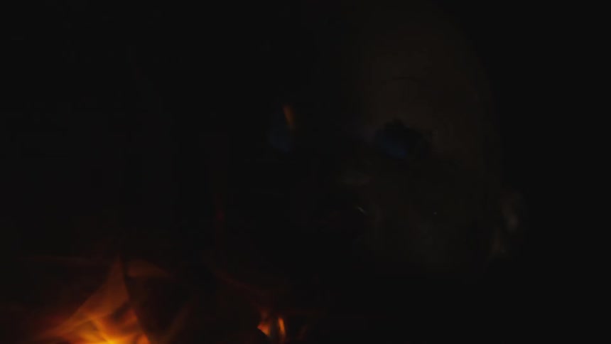 A mask is engulfed in flames
