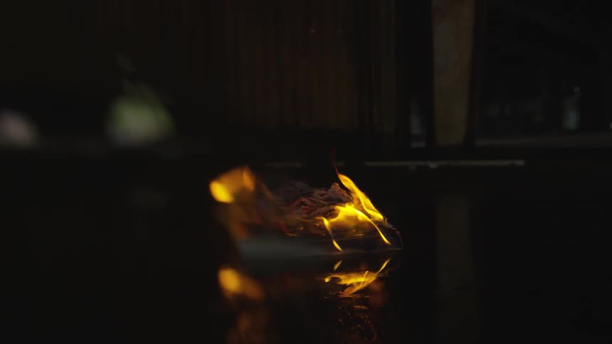 The book is burning on the floor