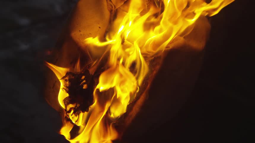 An object melts and burns outside at night