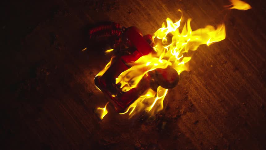 Abstract People Burning Various Objects In Warehouse