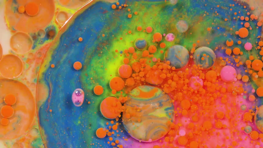 The many paints are mixed together in a swirl