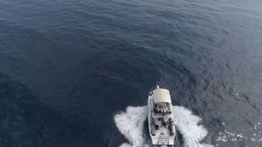 A boat is traveling through the water