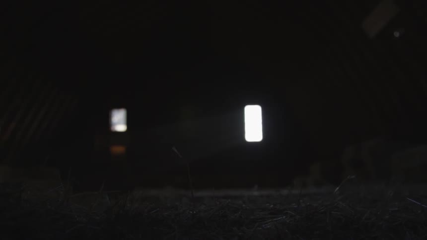 Rectangular lights are shown outside in the dark