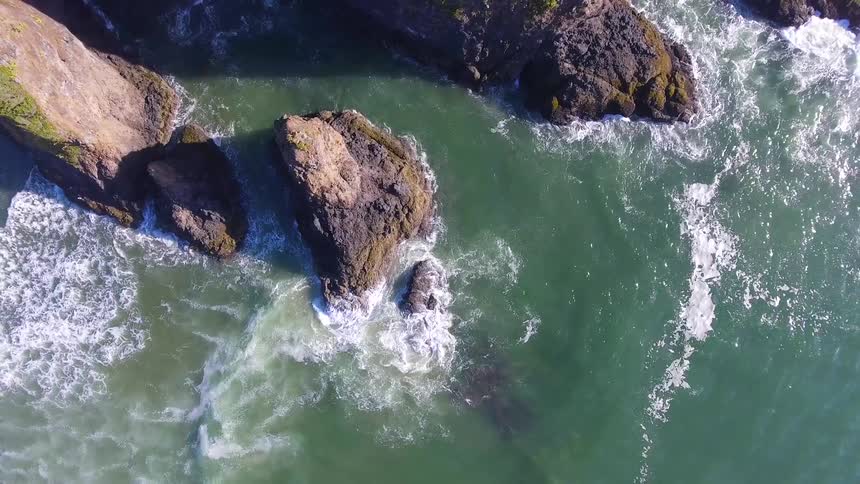 Birds eye view of rocky islands in ocean