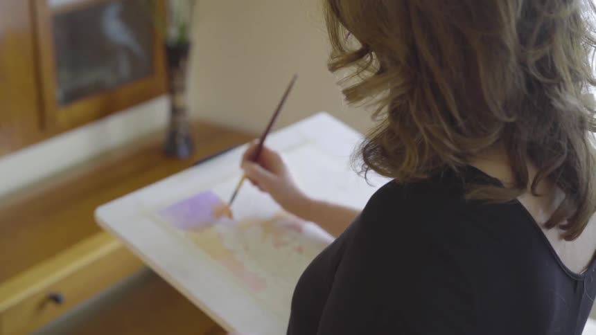 Artist Painting On Canvas