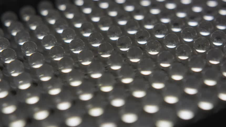 The counter is full of small clear spheres